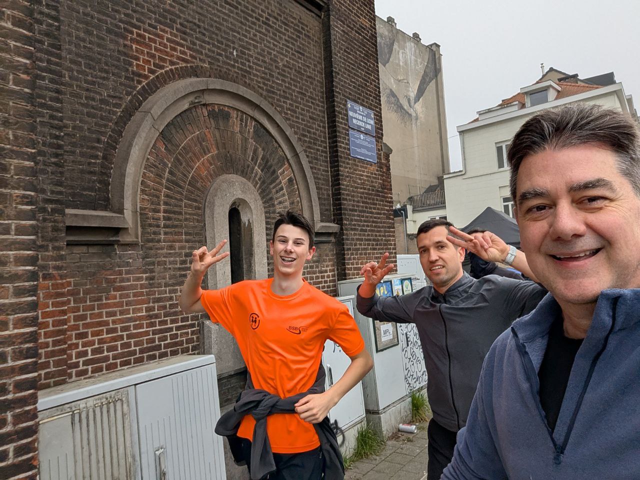 Romeo and friends by a brick church