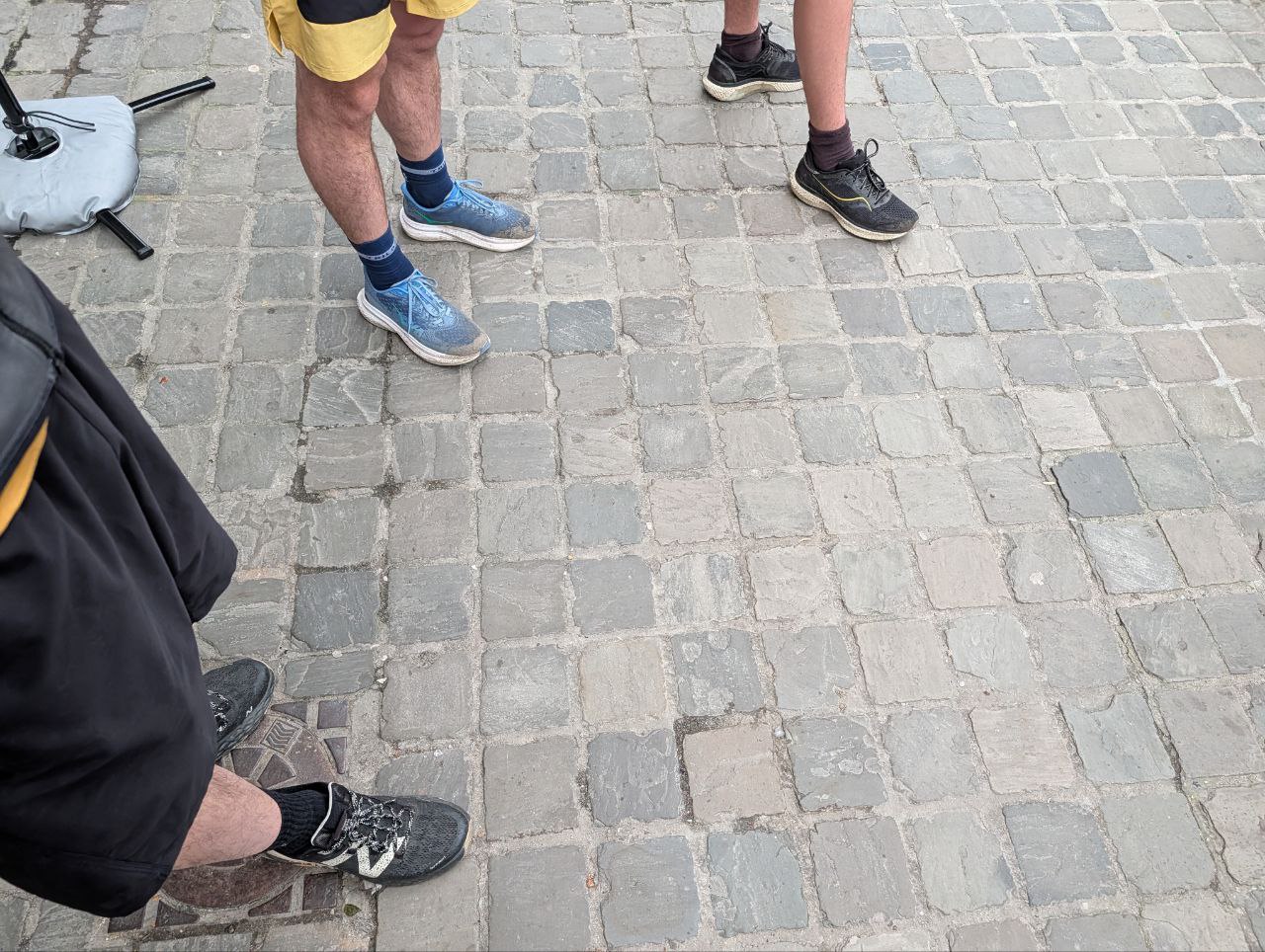 More running shoes on cobblestones